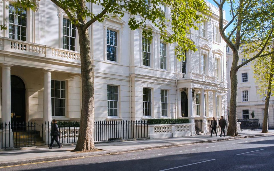 2013, Mayfair and the City, London, United Kingdom: Prime stucco-fronted residential and commercial buildings in central London photographed from street level in daylight in 2013. — Avanti Holding, European Expansion.